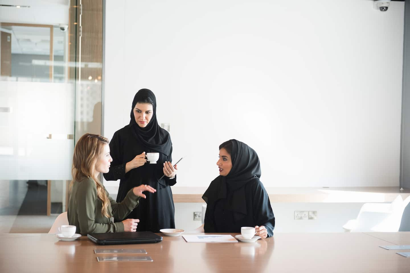 Multicultural business women in a conference room having a discussion